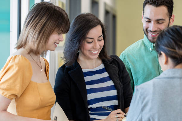 istock Diverse group of professional millennials in modern workplace brainstorming ideas together 1206765745