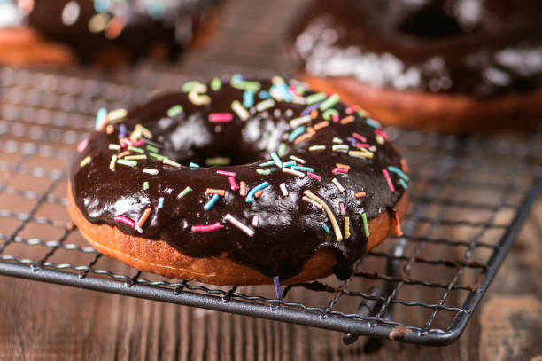 istock Donuts with chocolate glaze with sprinkles 1206766707