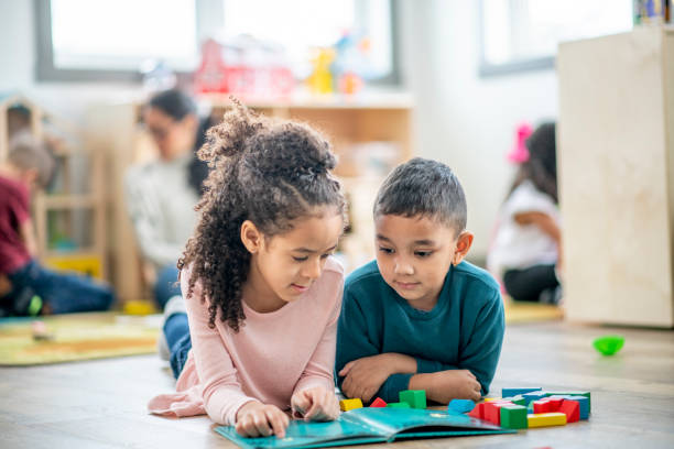 istock Daycare Reading Buddies stock photo 1206767768