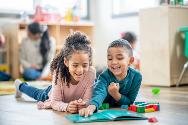 istock Daycare Reading Buddies stock photo 1206767769