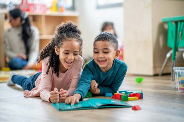 istock Daycare Reading Buddies stock photo 1206767772