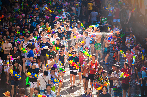 BANGKOK, THAILAND - April 13: Famous Songkran Festival in Silom on April 13, 2019. One of the most popular water fight places during Songkran in Bangkok, Thailand.