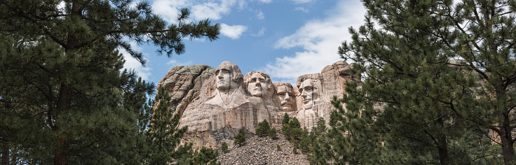 George Washington 1st President, Thomas Jefferson 3rd President, Theodore Roosevelt  26th President, Abraham Lincoln  16th President. Mount Rushmore National Memorial is a massive sculpture carved into Mount Rushmore in the Black Hills region of South Dakota. Completed in 1941 under the direction of Gutzon Borglum and his son Lincoln, the sculpture's roughly 60-ft.-high granite faces depict U.S. presidents George Washington, Thomas Jefferson, Theodore Roosevelt and Abraham Lincoln. The site also features a museum with interactive exhibits.