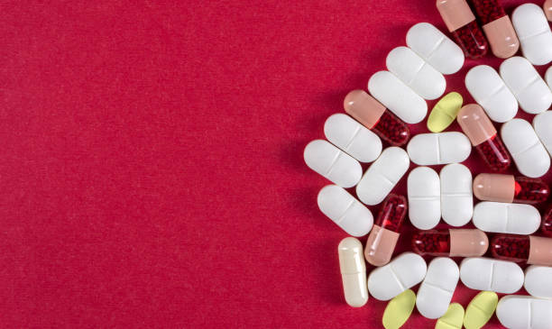 istock Pills and tablets over pink background 1206771505