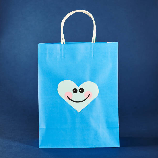 istock Shopping Bag with Cute Character Emoticon Face 1206771782