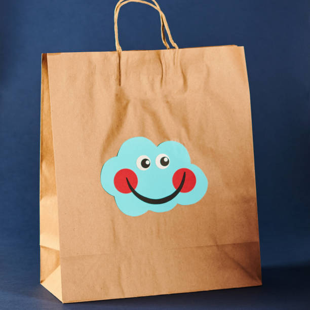 istock Shopping Bag with Cute Character Emoticon Face 1206771816