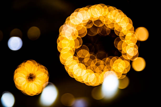 istock Blurred festive yellow and orange Christmas lights 1206775537