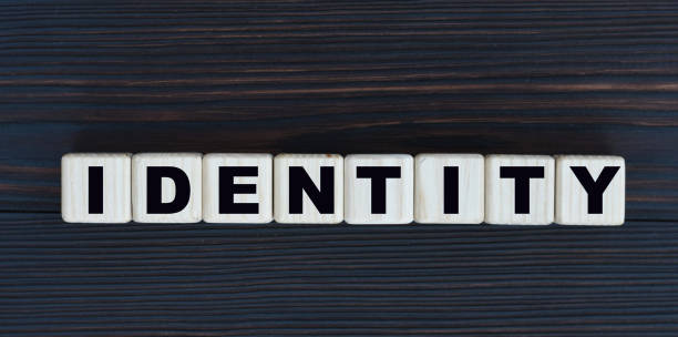istock concept word identity on cubes on a beautiful dark wooden background 1206775797