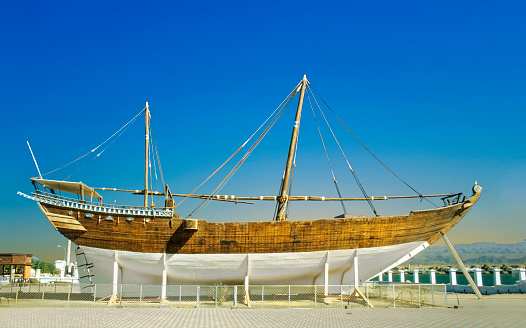 traditional dhau under construction in a wharft in Oman, Sur