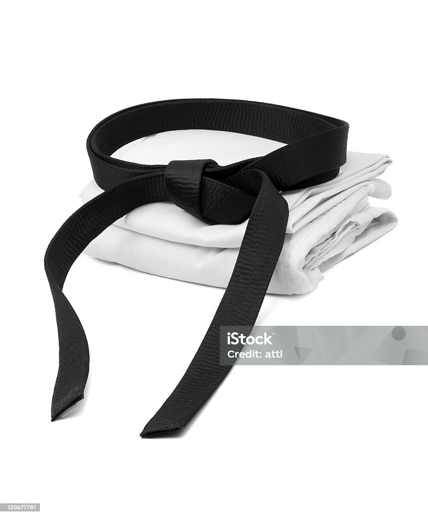 Martial arts uniform with black belt in white background Martial arts black belt and kimono Karate Stock Photo