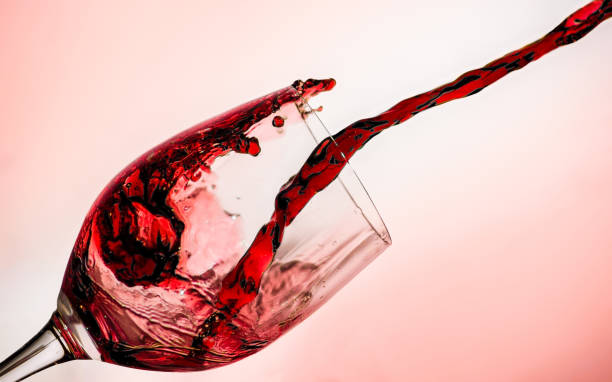 istock Red wine poured into a crystal glass 1206777959