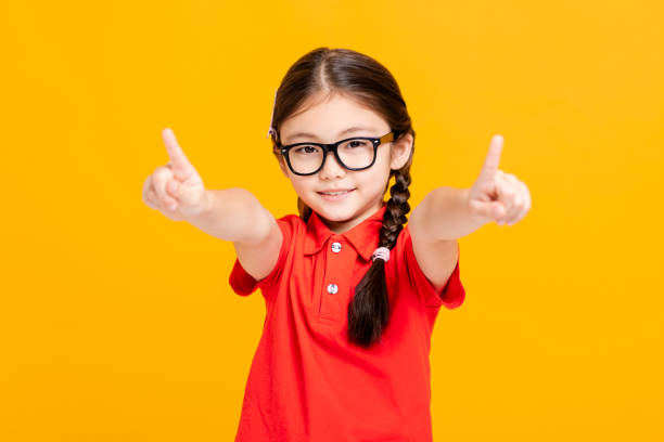 istock Adorable student girl  hand showing and pointing something 1206779226