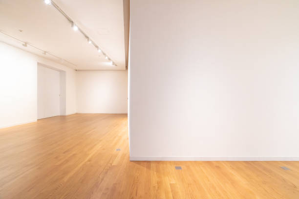 White walls and wooden floors in empty rooms