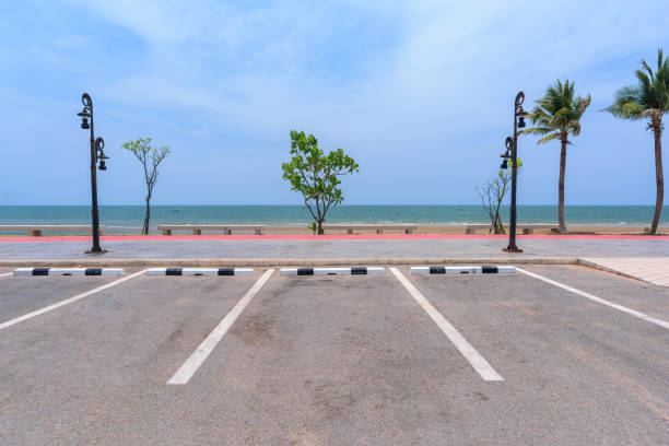 istock Empty parking lot against sea and beautiful blue sky. 1206780497