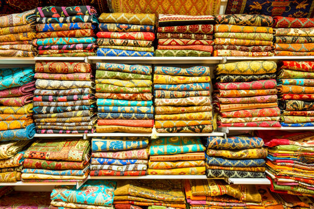 Colorful carpets and scarfs for sale at sevenirs shops in the Europe side of Istanbul, Turkey. stock photo