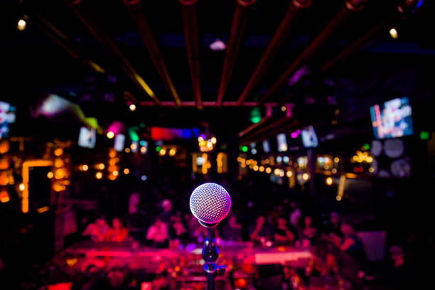 Microphone at a Comedy Show or Music Performance Show on Stage Entertainment Microphone at a Comedy Show or Music Performance Show on Stage Entertainment karaoke stock pictures, royalty-free photos & images