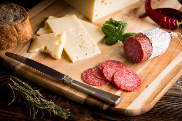 istock Dry salami or sausage with cheese and herbs 1206781483