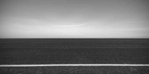 istock Side view of asphalt road with dark sky background 1206781945