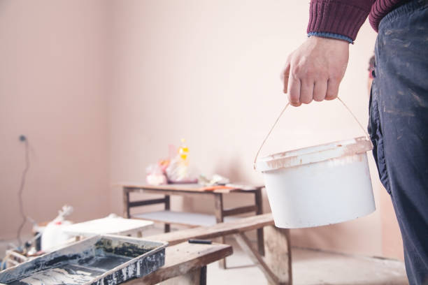 istock Man works at home. Worker with bucket paint. Renovation 1206781997