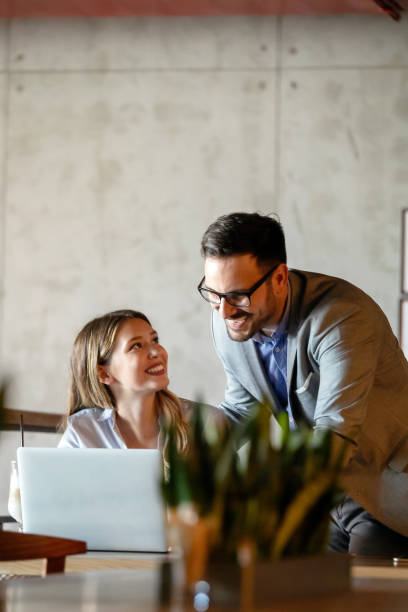 istock Business people having fun and chatting at workplace office 1206783117