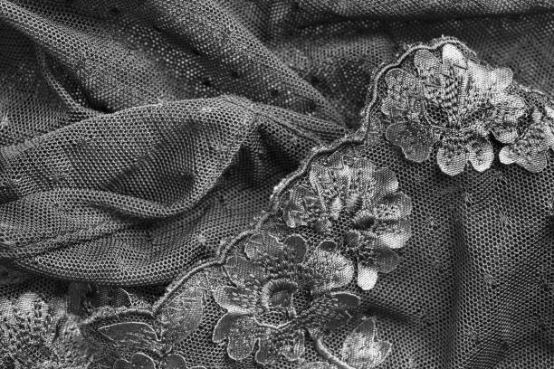 Black lacy background Black lacy embroidered crumpled fabrics closeup as a background lace black lingerie floral pattern stock pictures, royalty-free photos & images