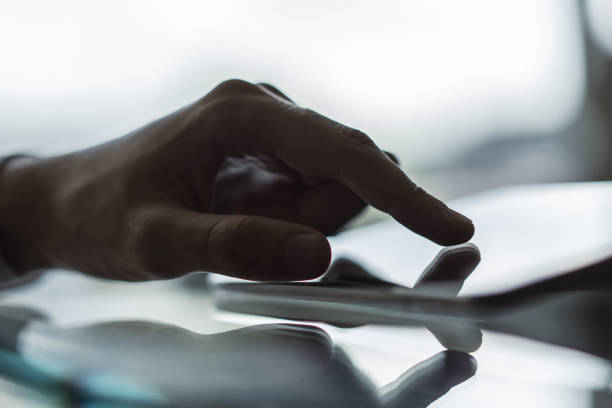 istock Man working with digital tablet in sunny office, business and technology concept. Close up 1206787093