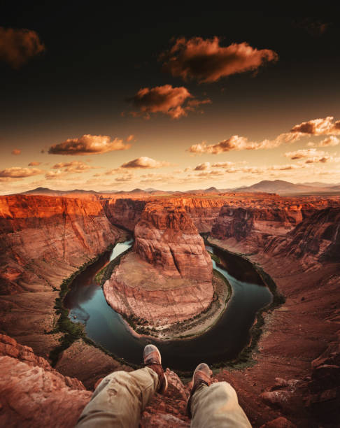 istock man resting at horseshoe bend in usa 1206787529