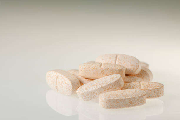 Isolated food supplement capsules on a white background.