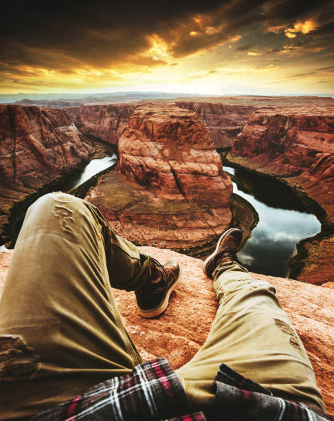 istock man resting at horseshoe bend in usa 1206788190