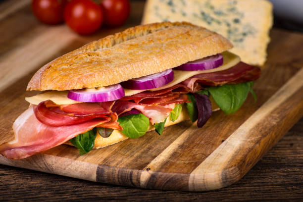 istock Long sandwich with sausage, chees and lettuce 1206788491