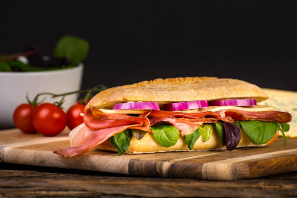 istock Long sandwich with sausage, chees and lettuce 1206788525