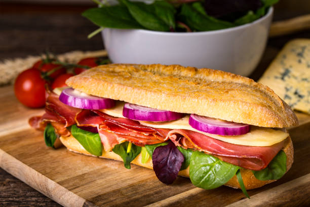 istock Long sandwich with sausage, chees and lettuce 1206788711