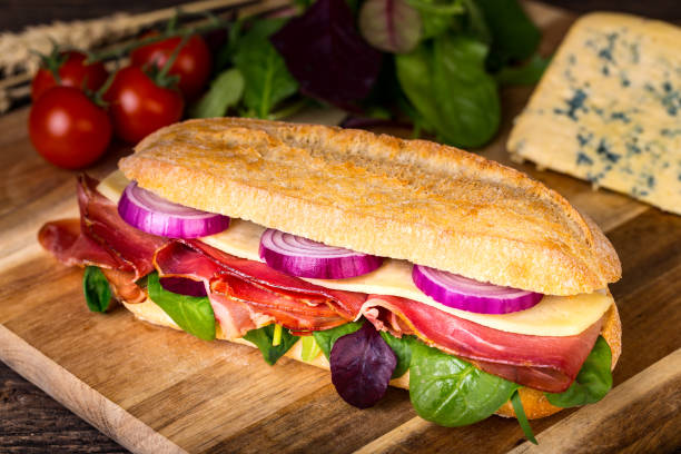 istock Long sandwich with sausage, chees and lettuce 1206788790