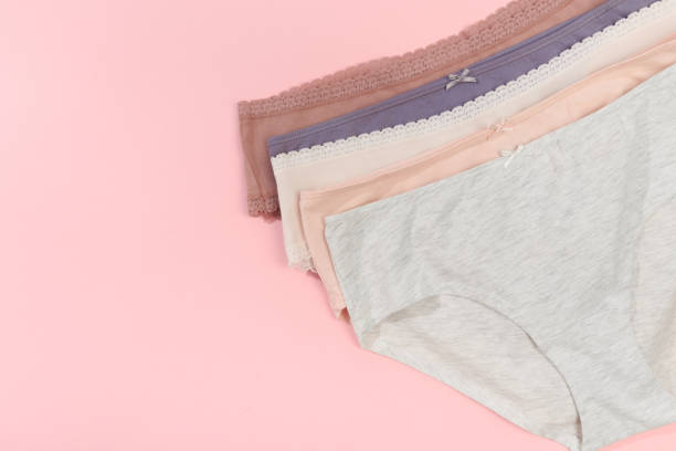 istock Female panties over pink  background 1206790083