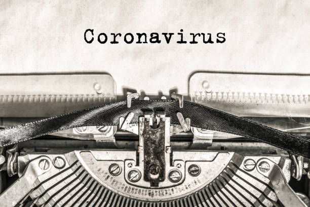 istock Coronavirus on a typewriter type text on old vintage paper. 1206790577
