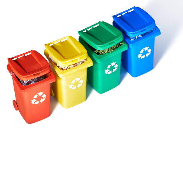 istock Four color coded recycle bins, isometric projection on geometric rainbow paper background with copy-space. Recycling sign on the bins - red, blue, yellow and green isolated on white. Waste separation 1206791570