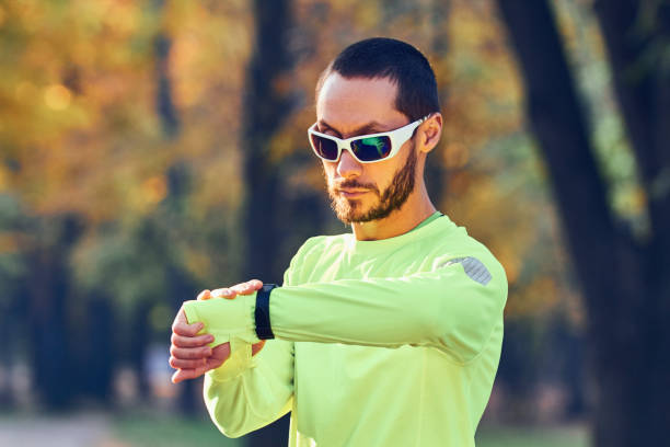 istock Man preparing for jogging / exercising in the park. 1206793401