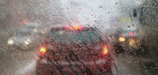 istock View from the car windscreen during rain and wet snow. Poor visibility while driving around the city. Snowy road. 1206794221