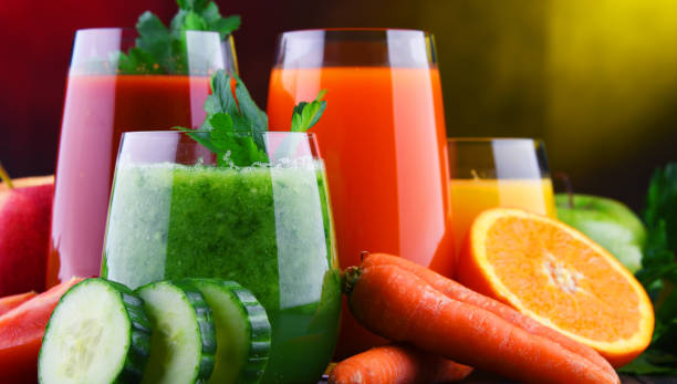 istock Glasses with fresh organic vegetable and fruit juices 1206794612