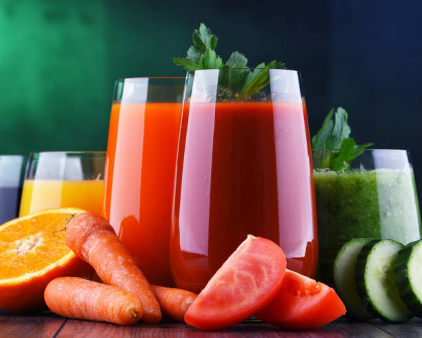 istock Glasses with fresh organic vegetable and fruit juices 1206794676