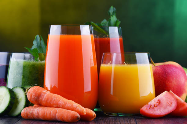 istock Glasses with fresh organic vegetable and fruit juices 1206794695