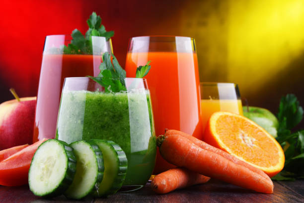 istock Glasses with fresh organic vegetable and fruit juices 1206794876