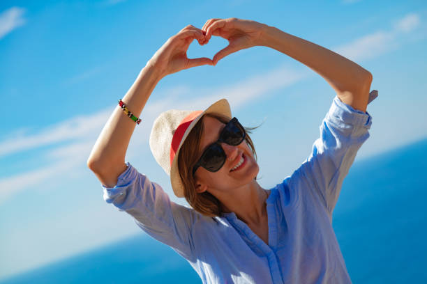 istock Woman in summertime with tropical ocean scenery. 1206795542