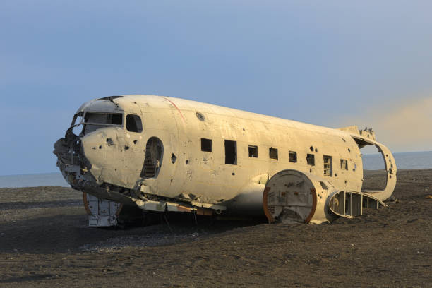 istock Plane Wreck on Iceland Beach at Sunset 1206795821