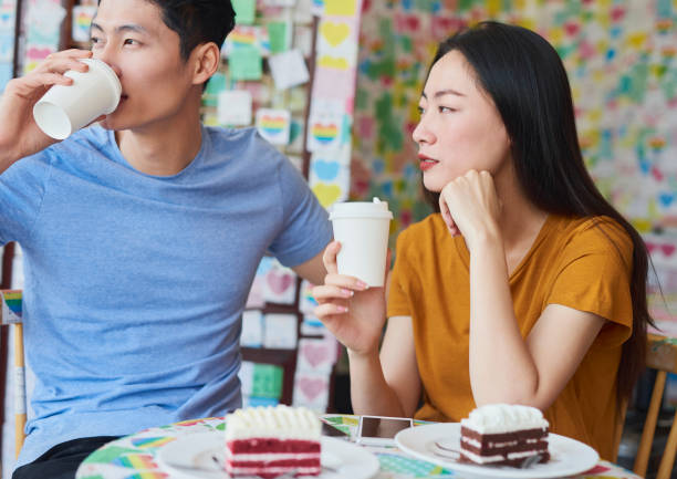 istock Young couple drinking coffee in a cafe 1206795917