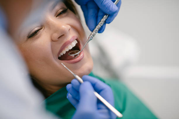 istock Young woman at the dentist 1206796348