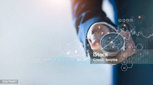 Businessman Holding A Navigation Compass In Hand And Define Marketing Direction And Analysis Growth Sale Data With Search Customer Global Network Abstract Business Stock Photo - Download Image Now