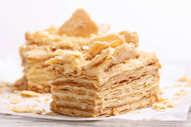 istock Two pieces of sweet layer cake. 1206797438
