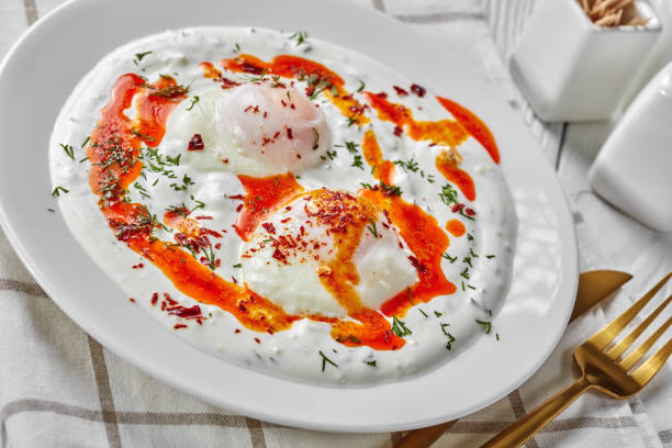 cilbir, poached eggs in yogurt sauce topped with spicy butter