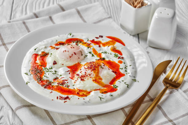 istock cilbir, poached eggs in yogurt sauce topped with spicy butter 1206797823